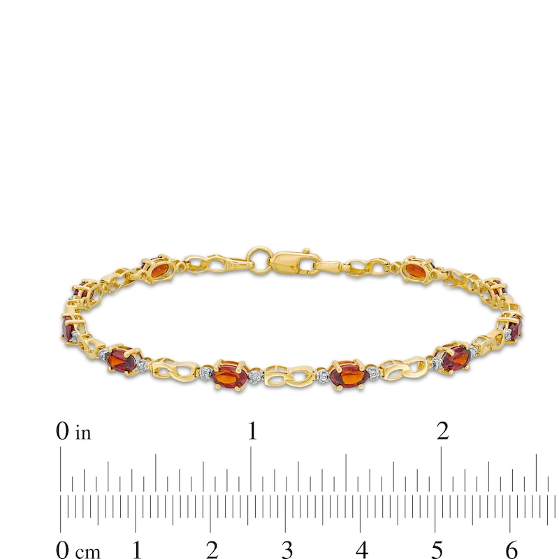 Oval Lab-Created Ruby, Diamond Accent and Rice Bead Alternating Bracelet in 10K Gold - 7.25"