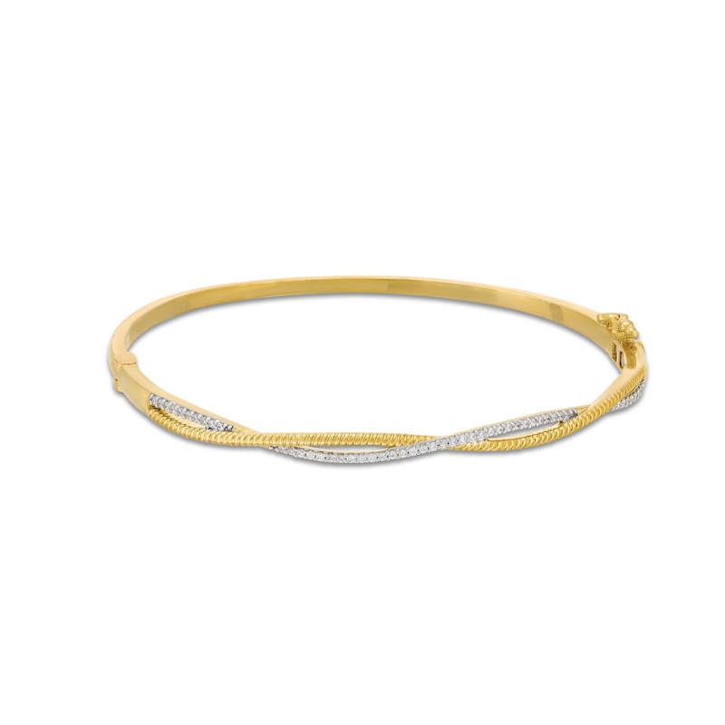 1/4 CT. T.W. Diamond and Rope-Textured Ribbon Twist Bangle in 10K Gold