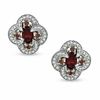 Thumbnail Image 0 of Oval Garnet and 1/3 CT. T.W. Enhanced Red and White Diamond Earrings in Sterling Silver
