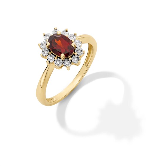 Oval Garnet and Diamond Accent Sunburst Frame Ring in 10K Gold